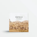 Product packaging with mountain design and 'Skinfood' branding on a white background